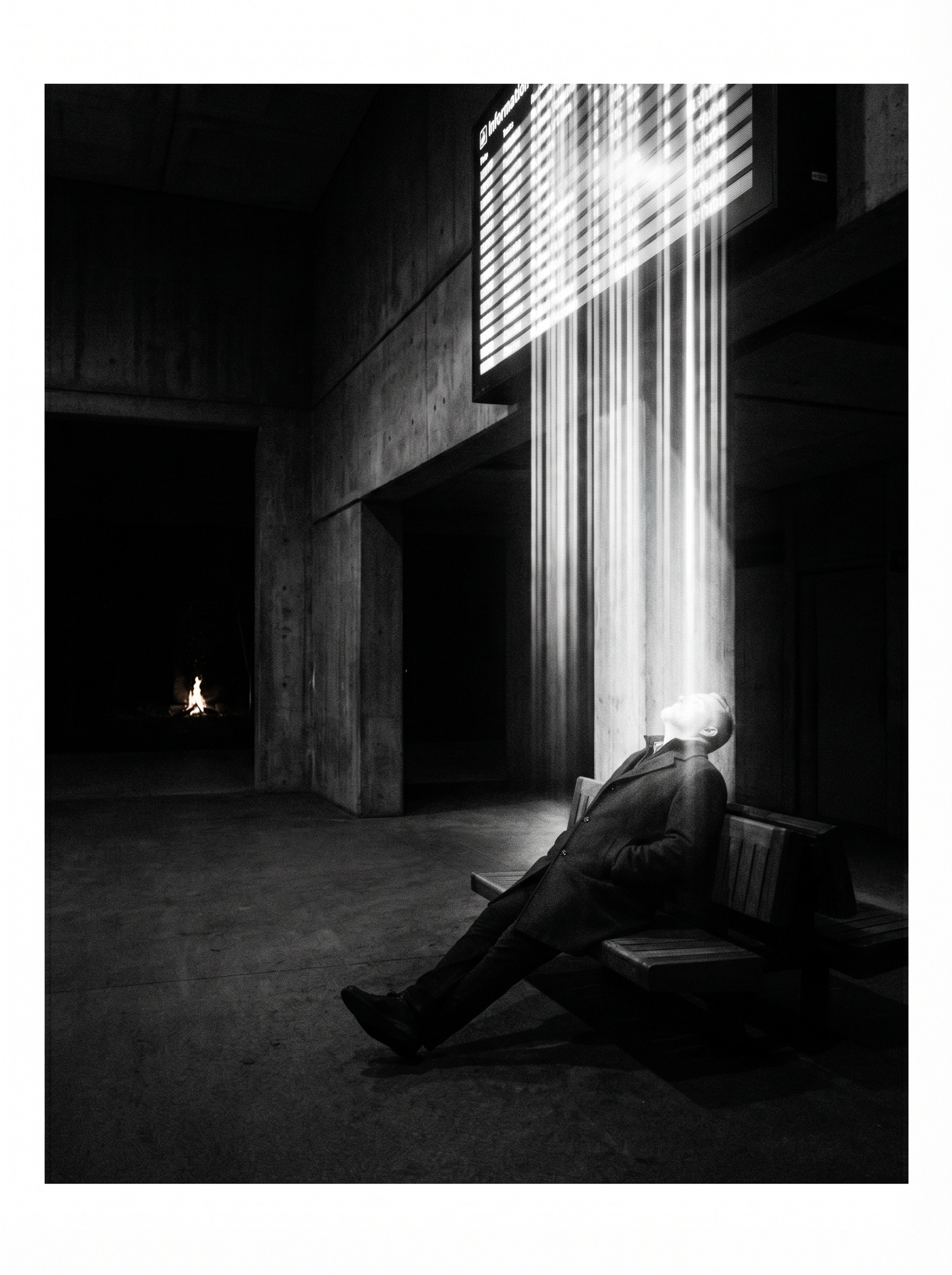 Figure bathed in screen light, head tilted upward in passive reception. In the far background, through a gap in the architecture, a small warm fire burns — unnoticed. Fuji X-Pro1 aesthetic, Vivian Maier and Trent Parke lineage.